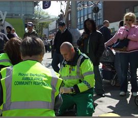 Community First responder three ambulance community responders attending a pretend casualty whilst the public watch on